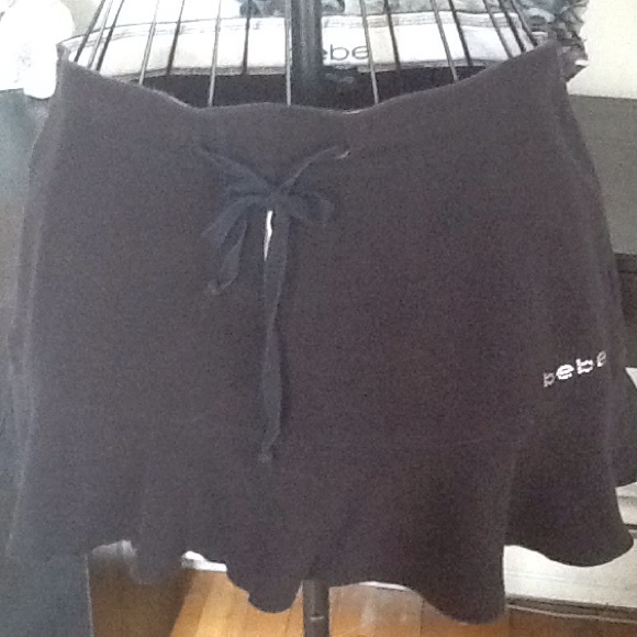 bebe Dresses & Skirts - Like new bebe ruffled  hem logo skirt