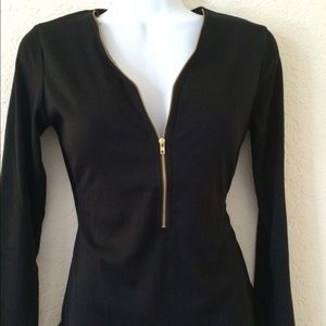 Black longsleeve tops with zipper on the front