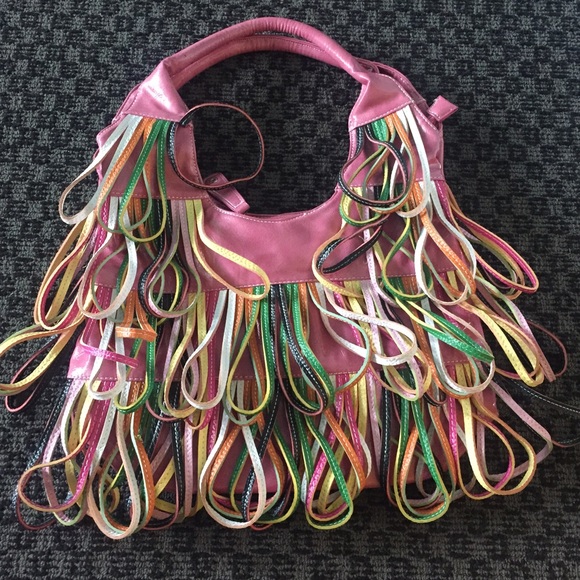Pink purse with dangling straps