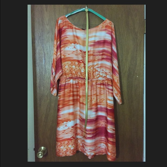 Knee length.  Gold belt.  Purchased from Dillard's