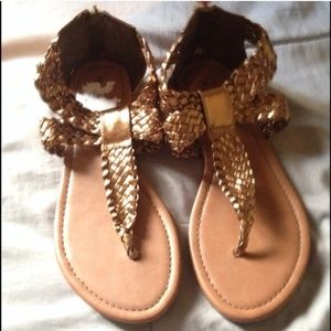 Metallic gold sandals.