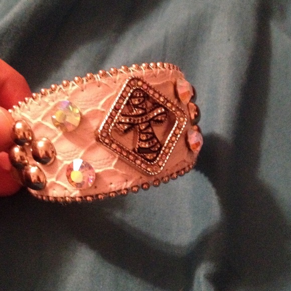 White bracelet with a cross