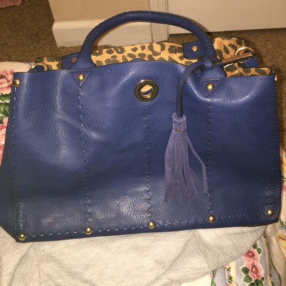 navy blue hangbag with shoulder strap.