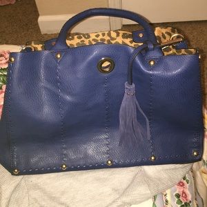 navy blue hangbag with shoulder strap.