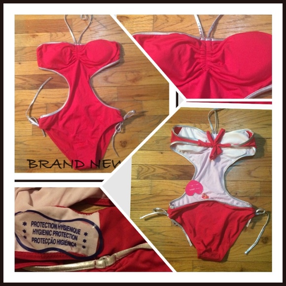 Brand new. Hot pink with silver bathing suit.