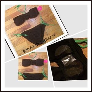 Brand new 2 piece black and green bathing suit