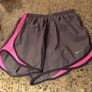 Nike shorts in a dark khaki/pink
