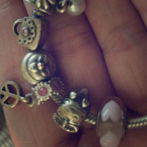 pandora heart, peace sign, and owl charm.