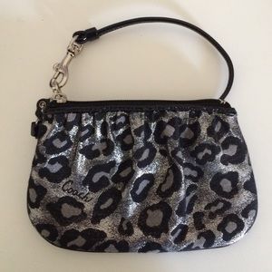 A cheetah print coach wristlet
