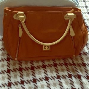 Light brown with white purse. In great condition!
