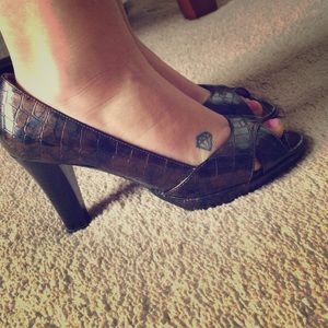 Brown and black opened toed snack skin heels