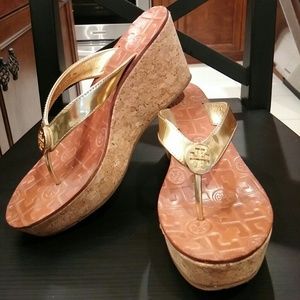 Tory Burch gold wedge flip flops