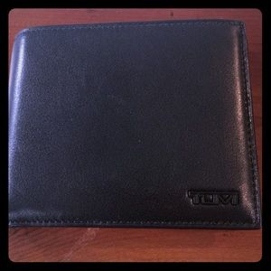 Brand new tumi wallet; will not go down on price.