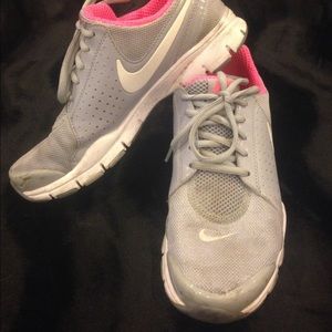 Nike grey slip on sneakers w/neon inside.