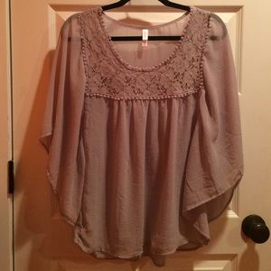 Butterfly sleeve shirt.