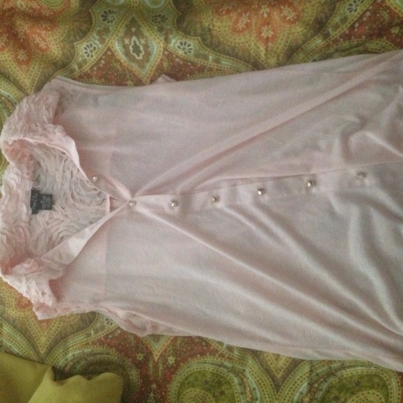 Baby pink top with floral detailing.