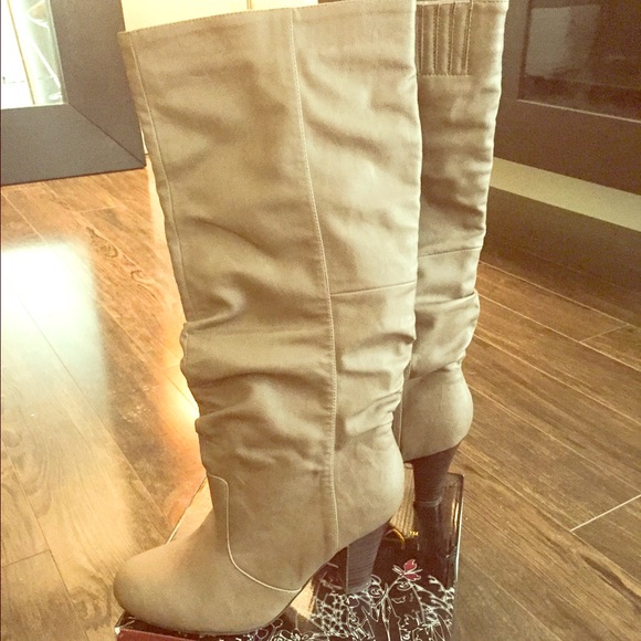 Tan low heel boots.