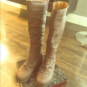 Brown mid calf boots.