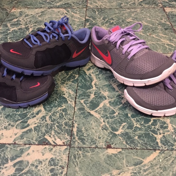 Bundle of two Nike running sneakers.