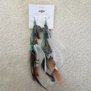 Icing Claire's earrings tribal feathers