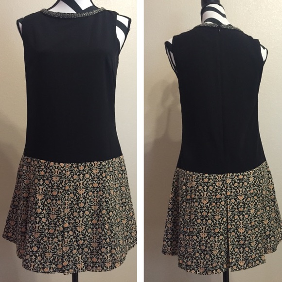 Dress w/ patterned bottom & embellished neckline.