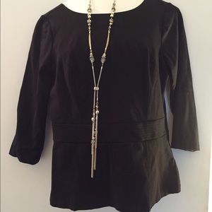 black peplum top, scooped BACK with silver buttons