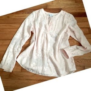 Light pink/peach blouse.