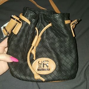 Black and tan woven bucket bag