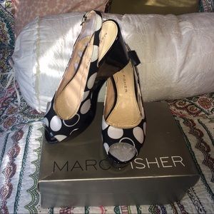 Open toe black/white wedge sandals.