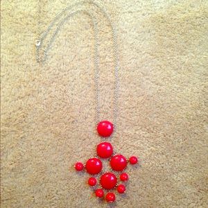 Long red statement necklace
