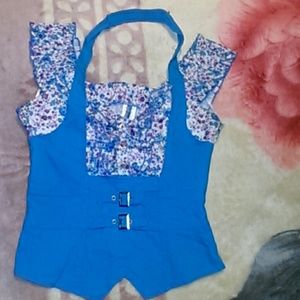 A blue with white shirt with purple flowers