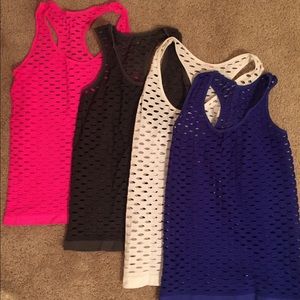 4 workout shirts-blue, pink, gray and white.