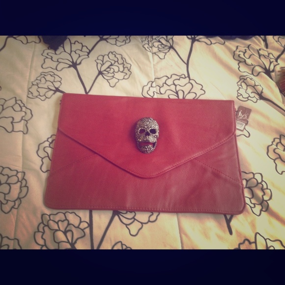 Red scull head clutch bag
