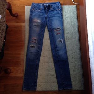 Destroyed patched jeans