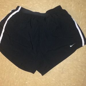 black nike running shorts.