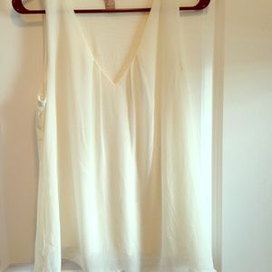Cream Flowy tank.
