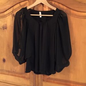 Black blouse with peek-a-boo sleeves