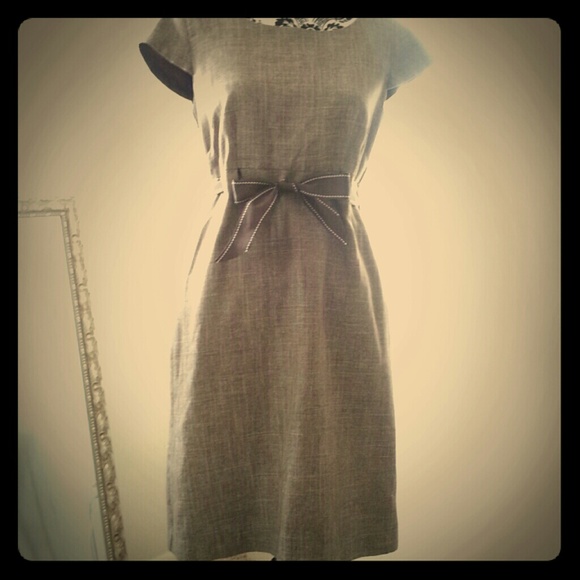 A knee- length Grey Dress w/ a Brown Ribbon