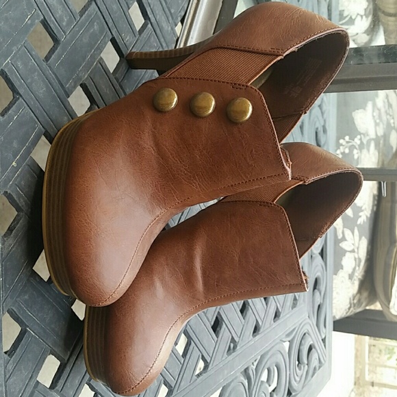 Brown stacked heel booties stretch side