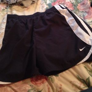 navy blue and white nike running shorts
