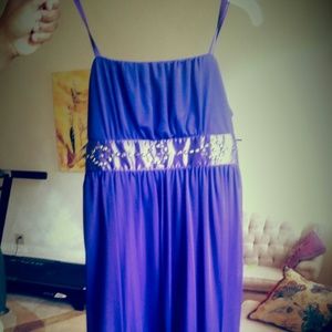A purple flowy chiffon dress.