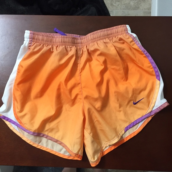 Orange and purple fade Nike shorts.