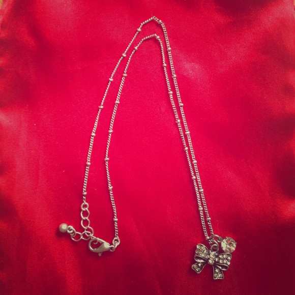 Diamond crusted bow necklace
