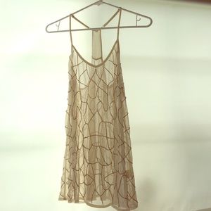 Sheer racerback tank with beading