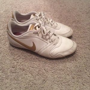 White and gold Nike sneakers