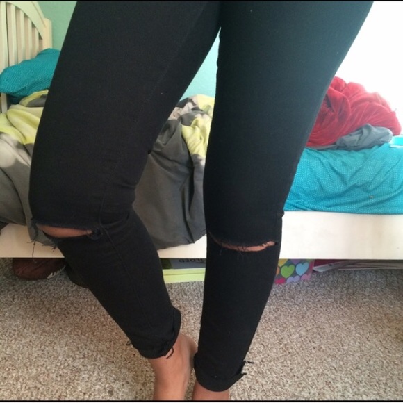 Black ripped at knee jeans