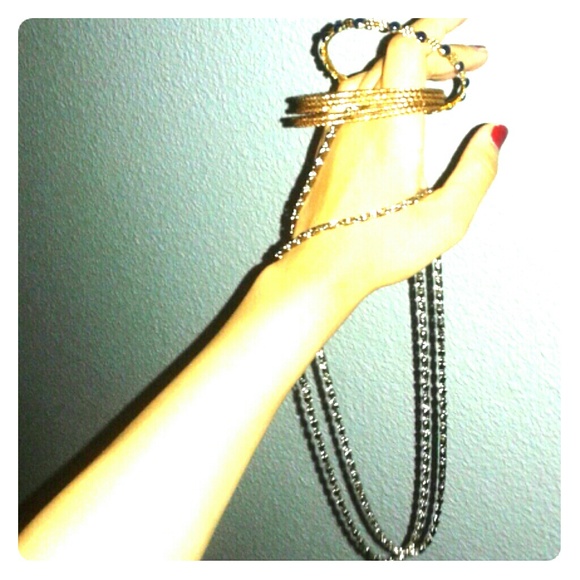 5 braclets w/ long chain necklace.