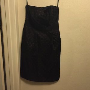 Black dress with dark red polka dots.