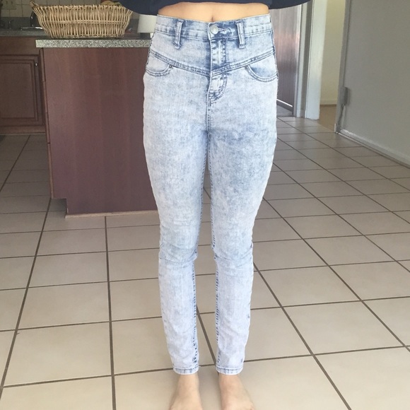 High rise blue denim jeans.