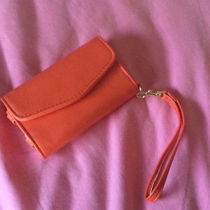 Orange wallet!! It holds iPhone 5s too!!😊😊